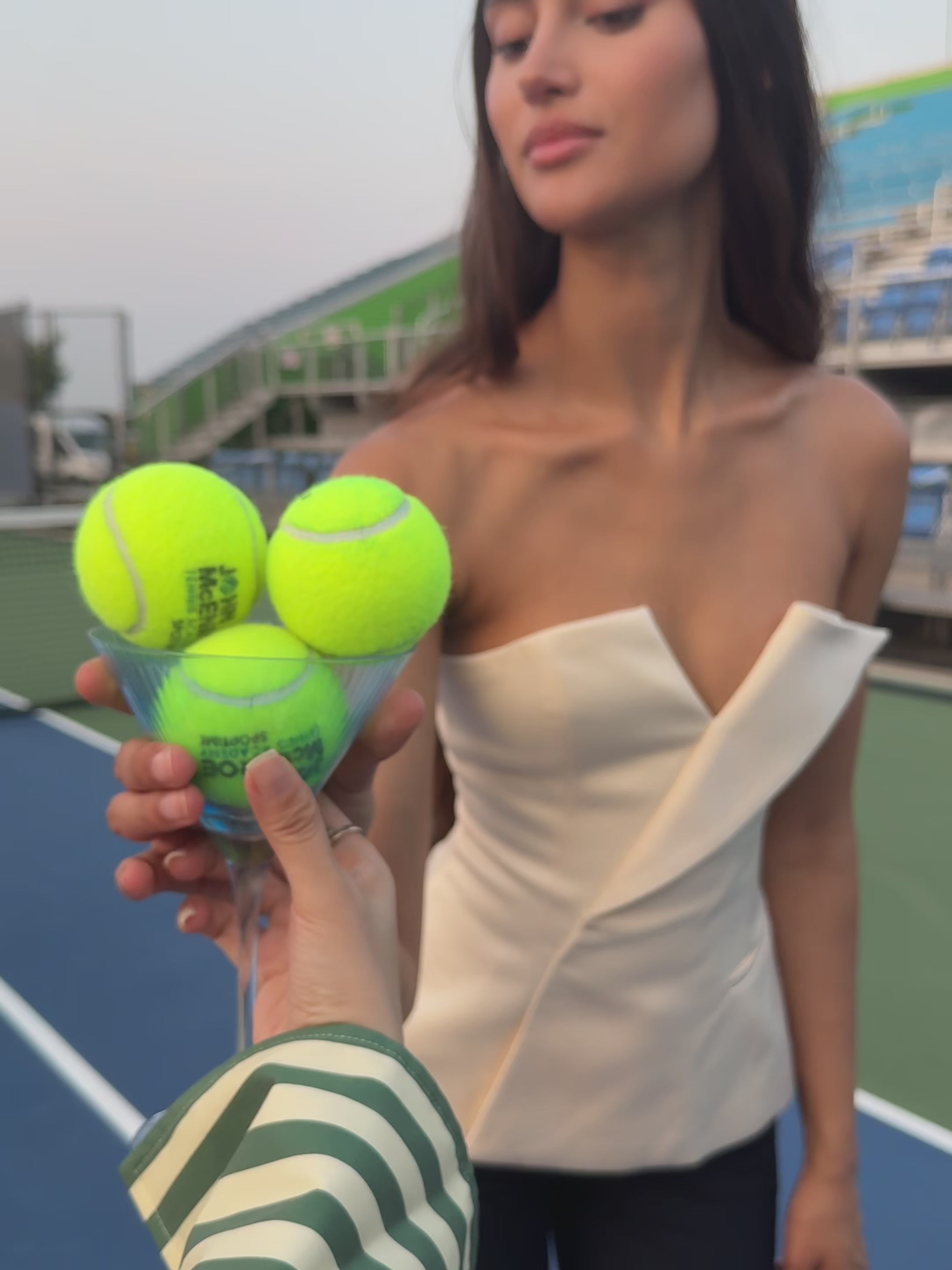 Yani Ivory Asymmetrical Lapel Sleeveless Peplum Top